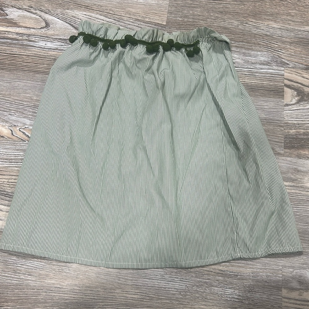 white and green striped top